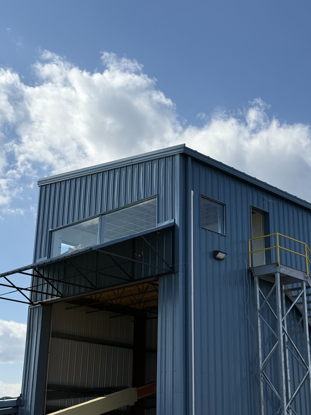 Metal-clad commercial building with a large canopy