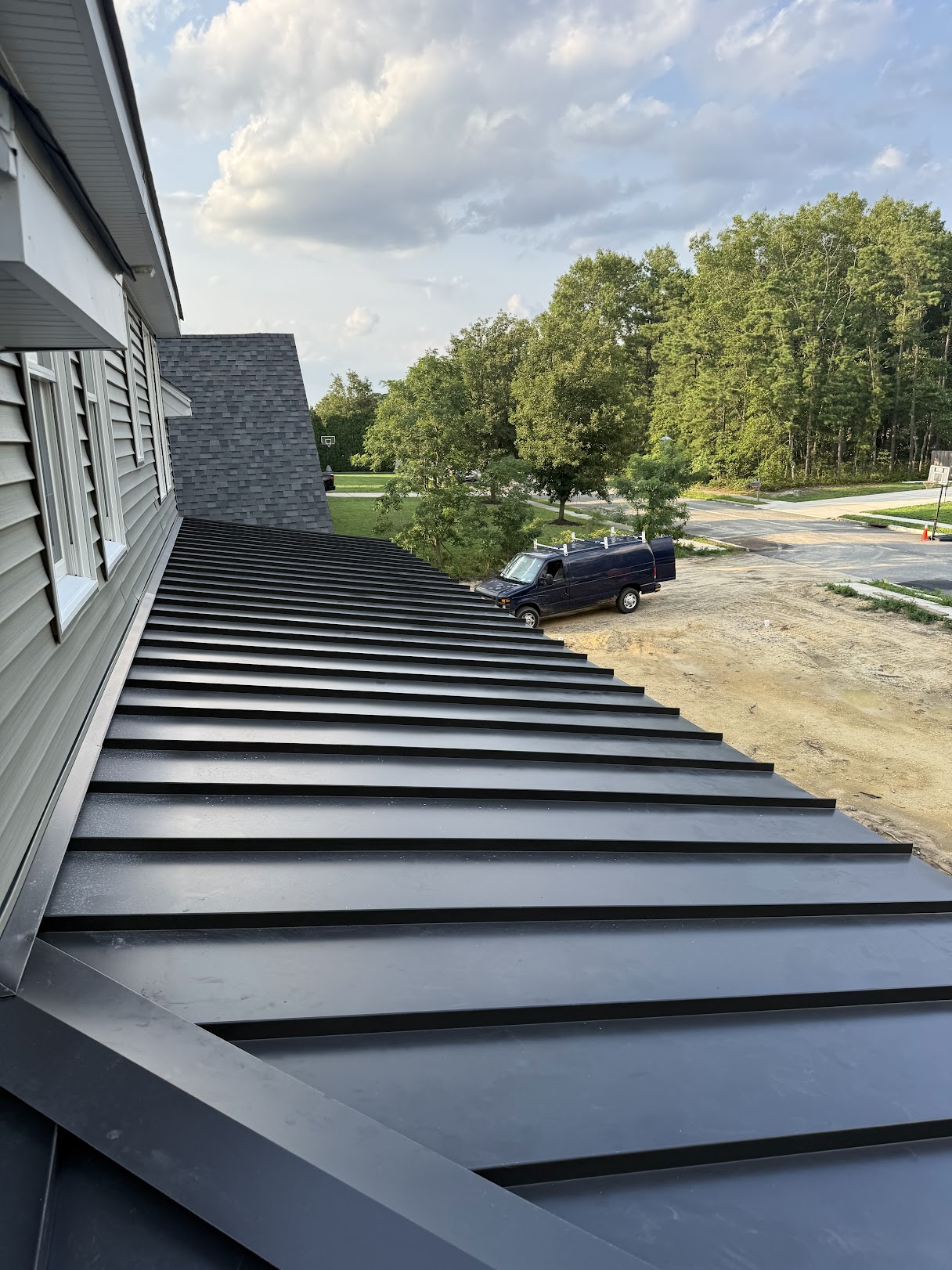 Close view along standing-seam metal porch panels